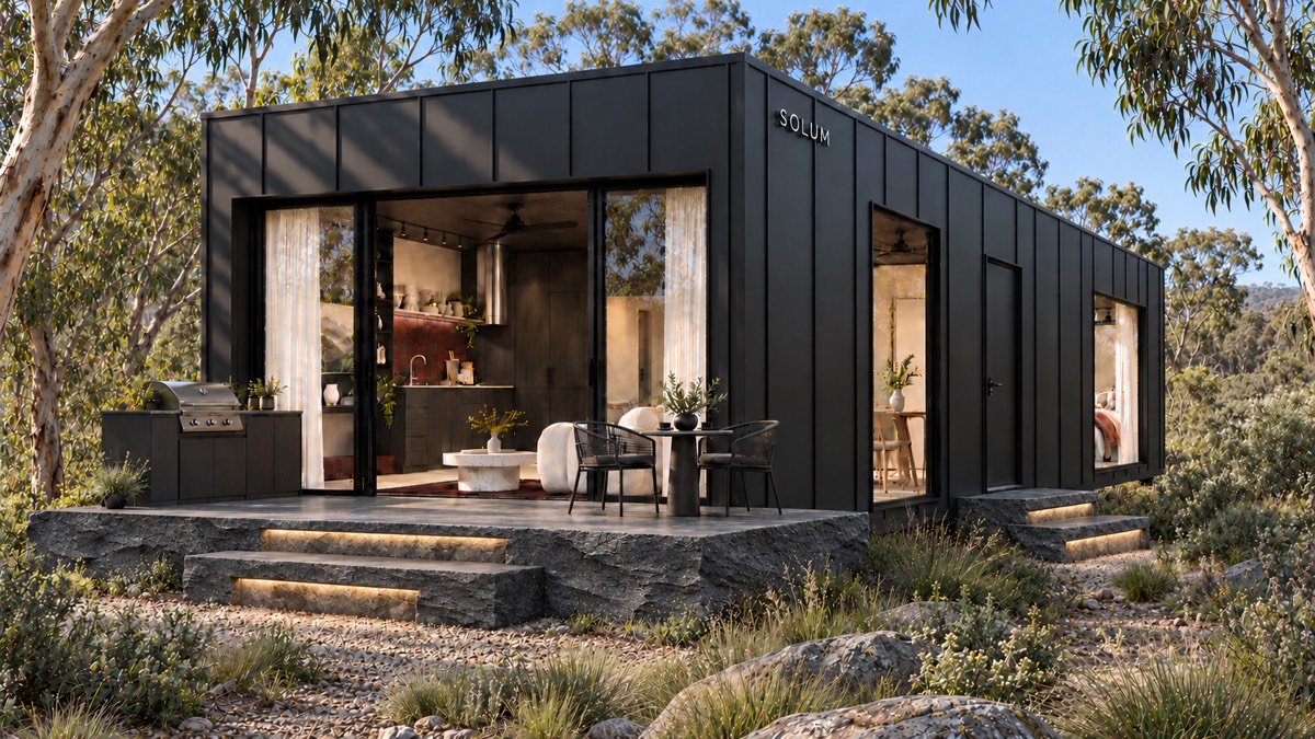 SOLUM Studio in Forge: the open front, over its stone terrace, in morning light