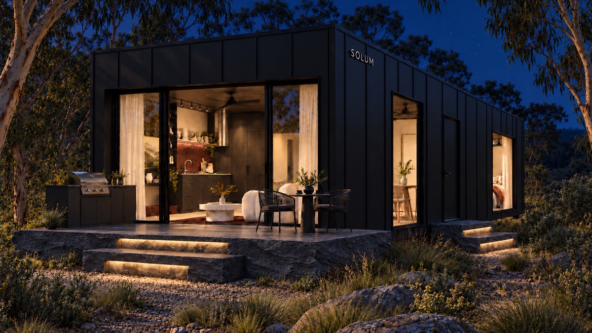 SOLUM Studio in Forge: the open front, over its stone terrace, after dark