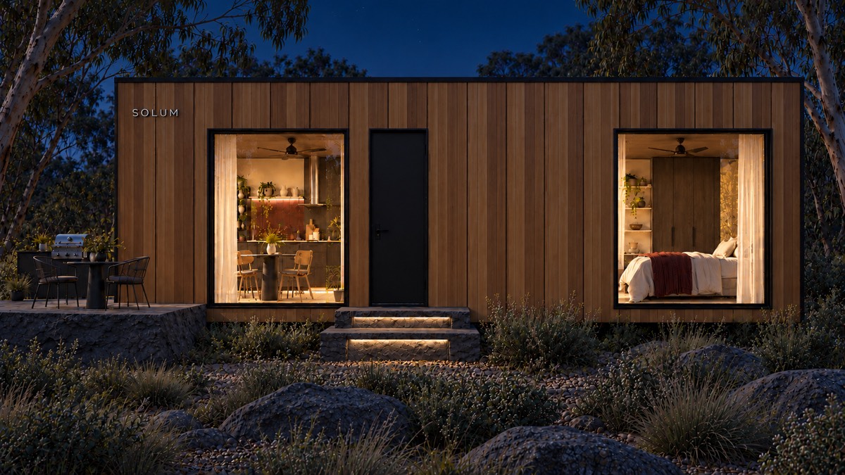 SOLUM Studio in Amber: the long side, through gum trees, after dark