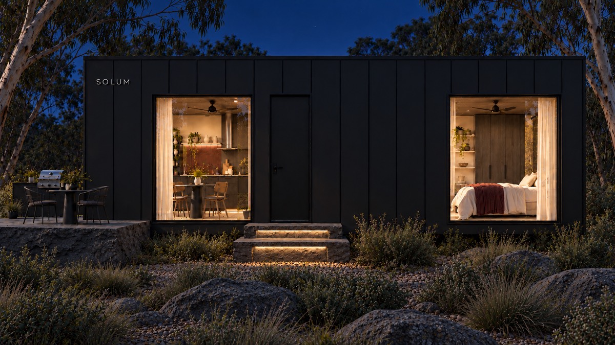 SOLUM Studio in Forge: the long side, through gum trees, after dark