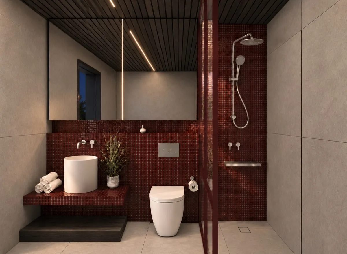 The bathroom of SOLUM Max in Burgundy, with dark oak joinery, after dark