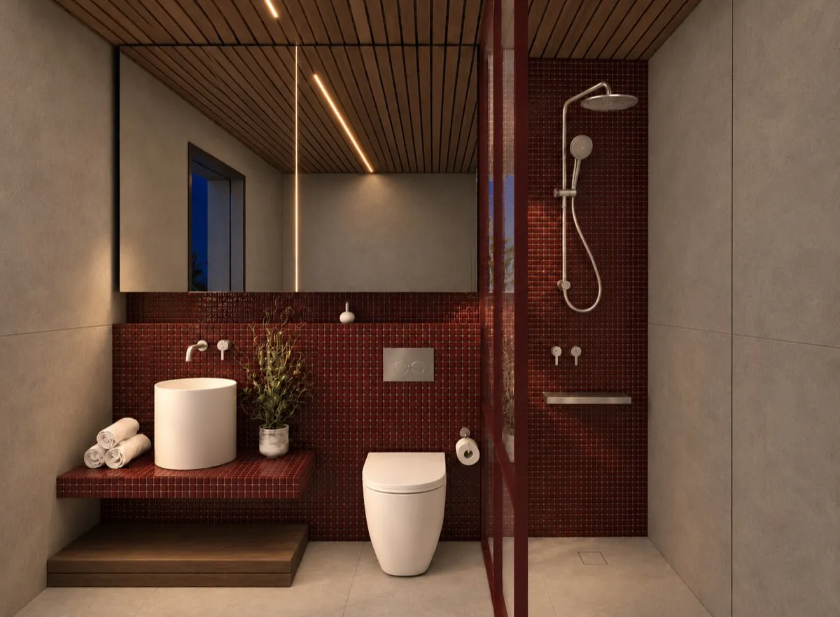 The bathroom of SOLUM Max in Burgundy, with raw walnut joinery, after dark
