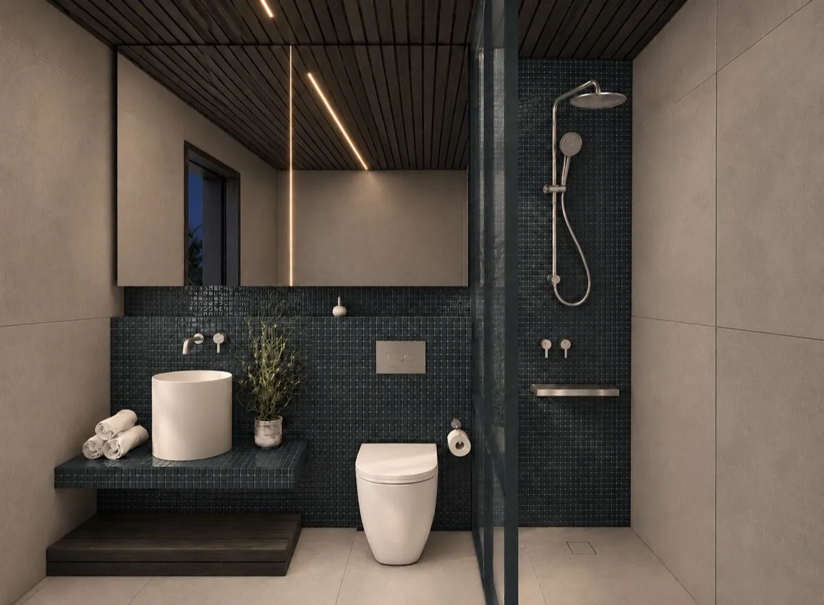 The bathroom of SOLUM Max in Tide, with dark oak joinery, after dark
