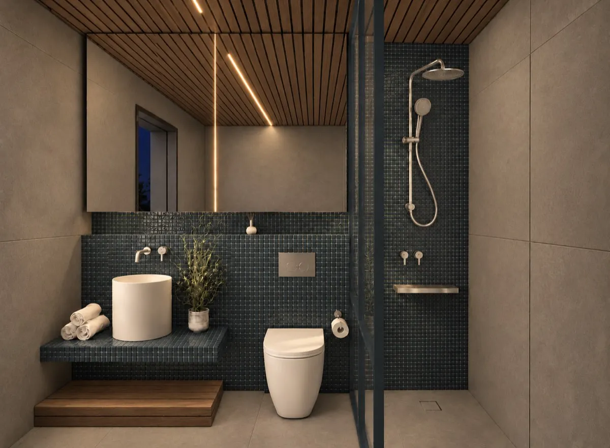 The bathroom of SOLUM Max in Tide, with raw walnut joinery, after dark