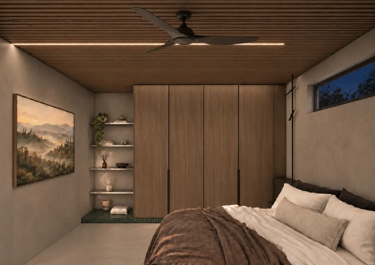 The bedroom of SOLUM Max in Sage, with raw walnut joinery, after dark