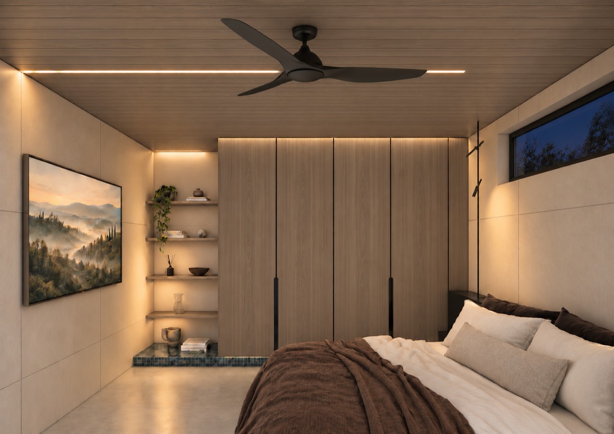 The bedroom of SOLUM Plus in Tide, with raw walnut joinery, after dark