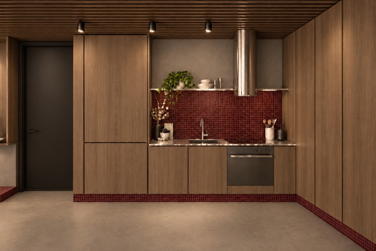The kitchen of SOLUM Plus in Burgundy, with raw walnut joinery, after dark