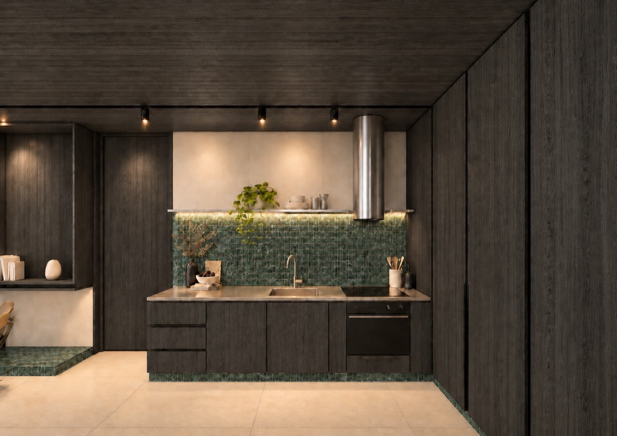The kitchen of SOLUM Plus in Sage, with dark oak joinery, after dark