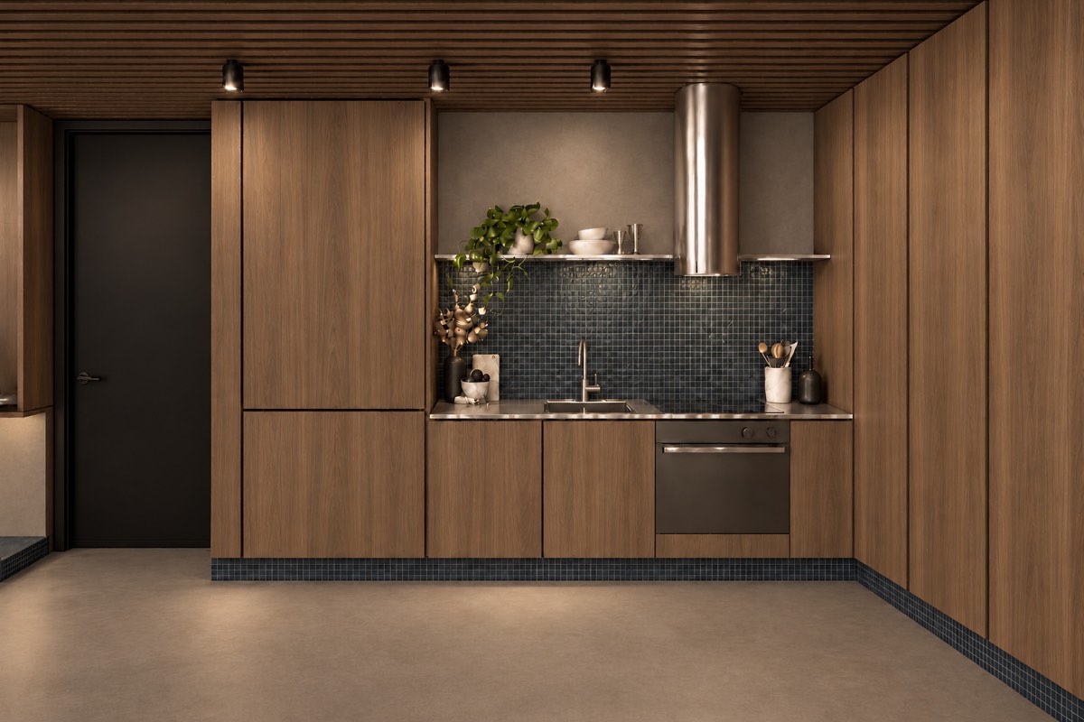 The kitchen of SOLUM Plus in Tide, with raw walnut joinery, after dark