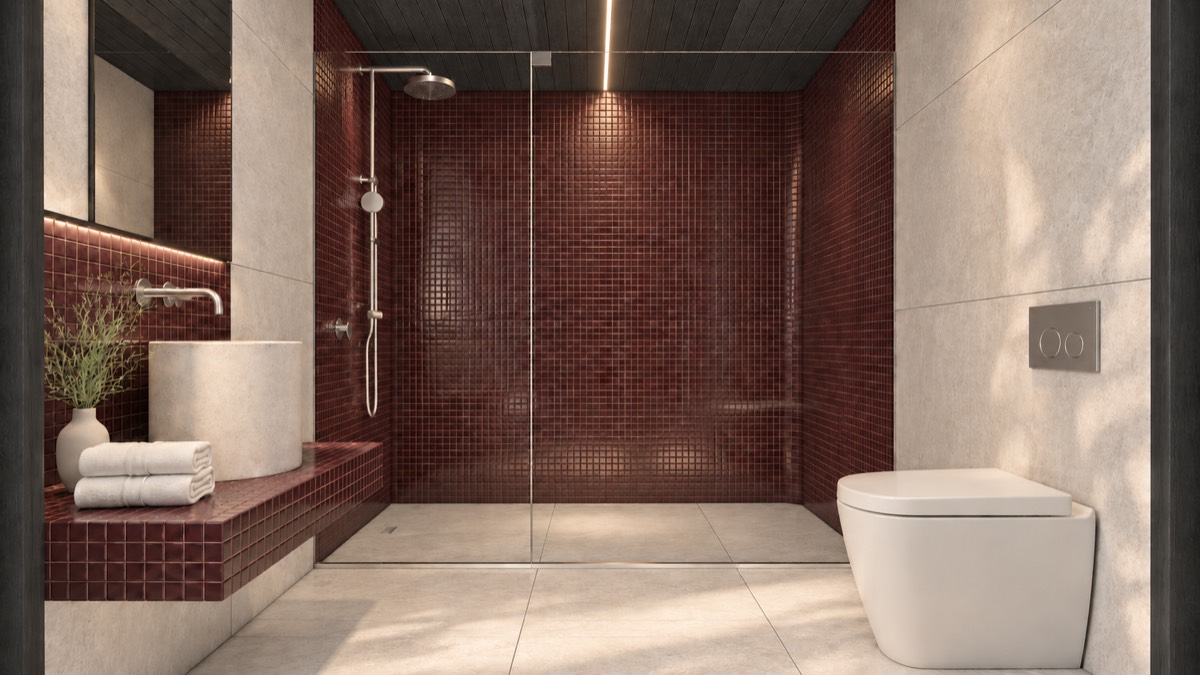 The bathroom of SOLUM Studio in Burgundy, with dark oak joinery