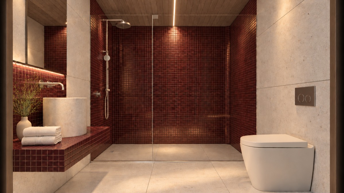 The bathroom of SOLUM Studio in Burgundy, with raw walnut joinery, after dark