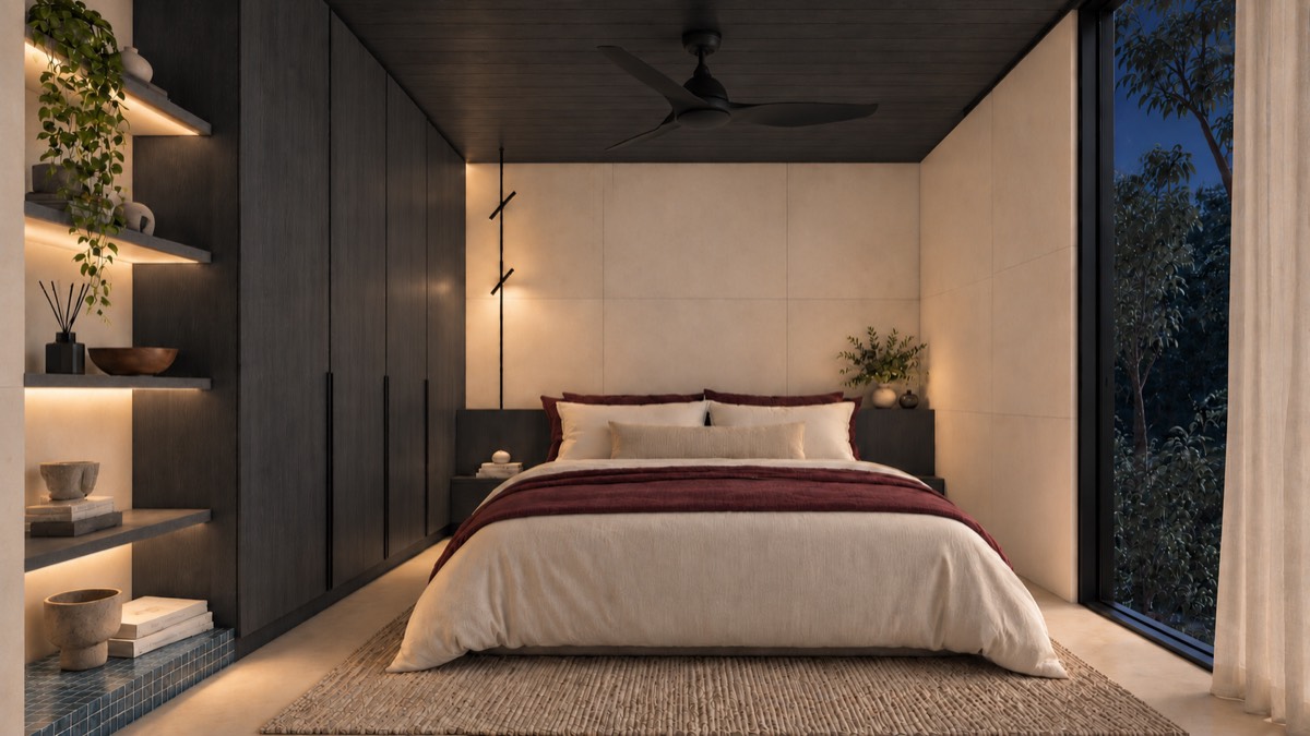 The bedroom of SOLUM Studio in Tide, with dark oak joinery, after dark