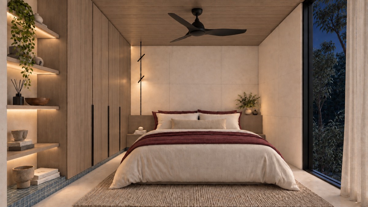 The bedroom of SOLUM Studio in Tide, with raw walnut joinery, after dark