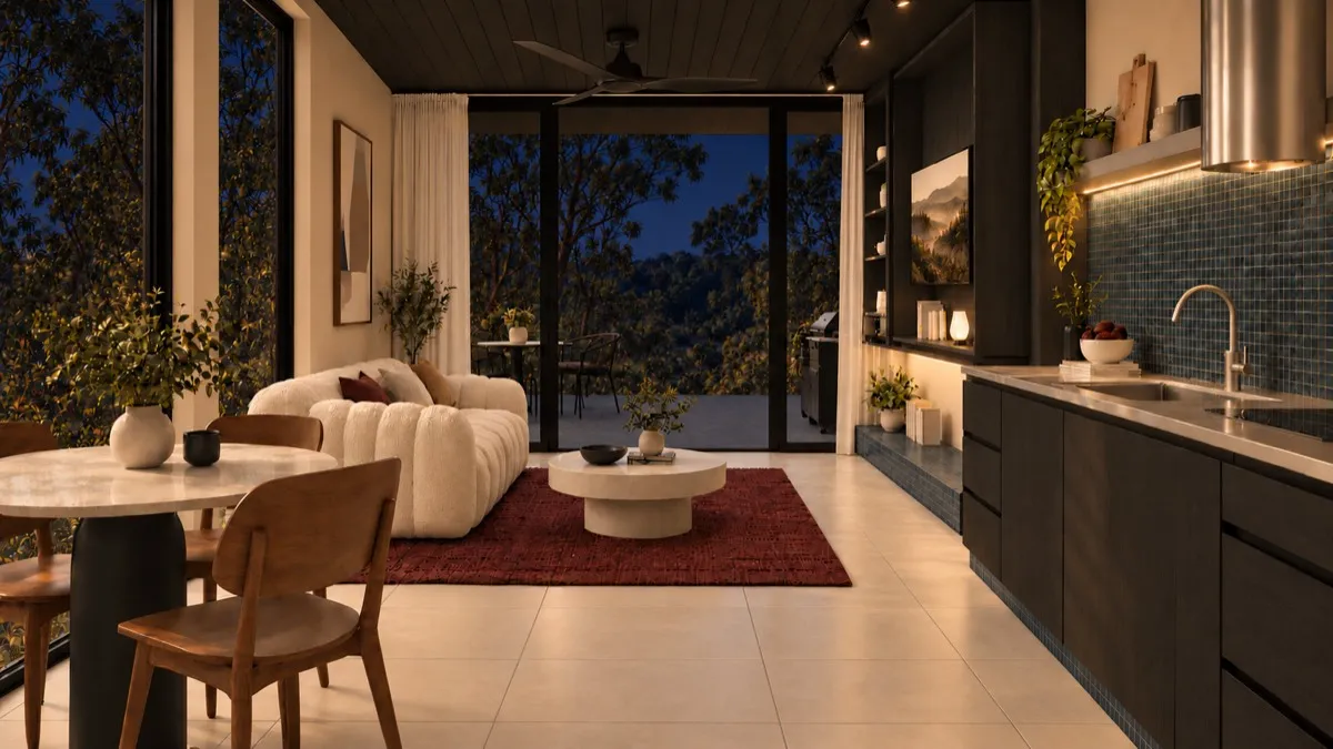 The living room of SOLUM Studio in Tide, with dark oak joinery, after dark